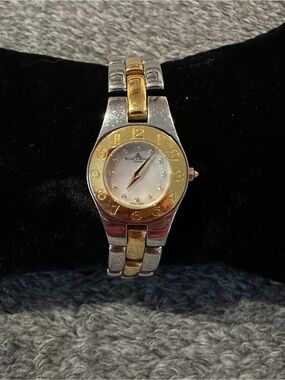 Baume & Mercier Linea 24mm two-toned 65304 watch w/ MOP face & diamond indices.